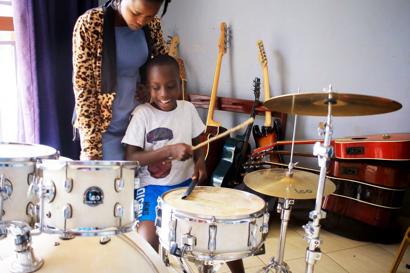 A boy playing drums